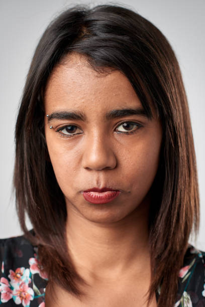 istock Studio portrait of mixed race woman making cute sad face 944577546