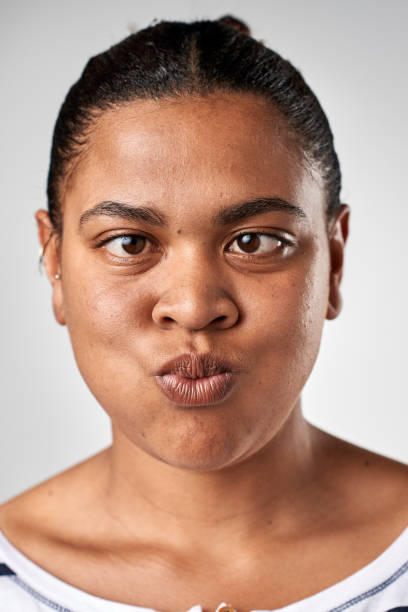 istock Studio portrait of mixed race woman pulling a silly face 944577652