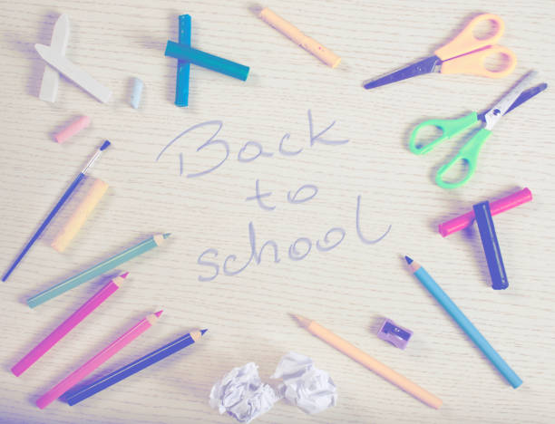 istock School supplies frame on white plank with 