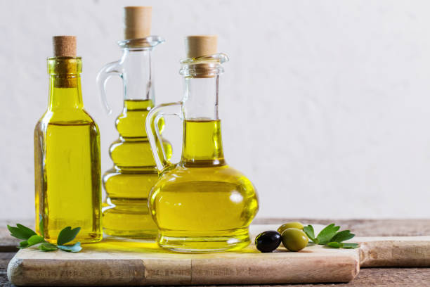 istock Olive oil  on the wooden table 944582036