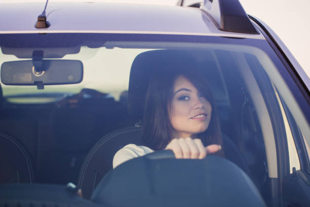 istock happy woman in car 944582232