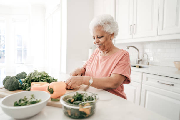 istock 70 years old lady with healthy recipes 944588020