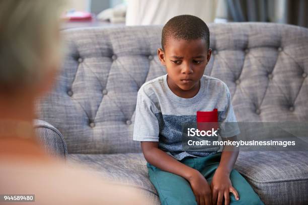 Young Boy Having Therapy With A Child Psychologist Stock Photo - Download Image Now - Mental Health Professional, Sadness, Child