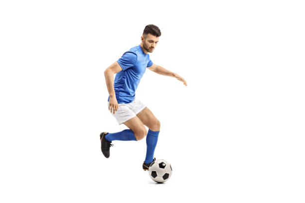 soccer player dribbling - soccer ball soccer ball cut out imagens e fotografias de stock