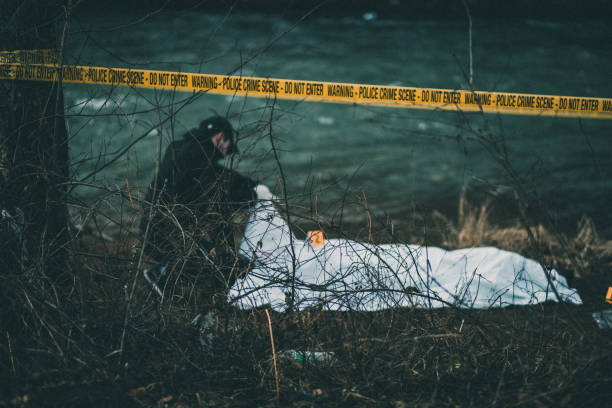 istock Detective investigating crime scene by the river 944589582