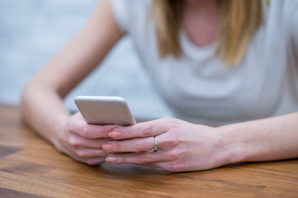 istock Woman on her phone 944589676