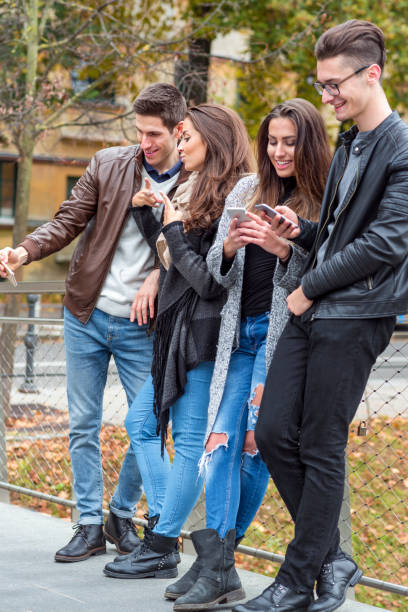 istock Young cheerful friends taking selfie 944596056