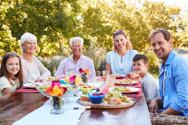 istock Three generation family having lunch in the garden 944596462