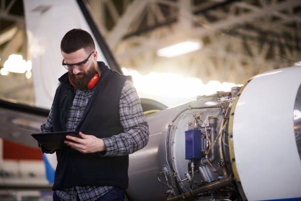 istock Aircraft mechanic in the hangar 944596680
