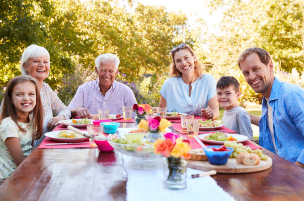 istock Three generation family having lunch in the garden 944597242