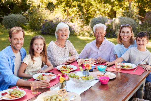 istock Three generation family having lunch in the garden 944597262