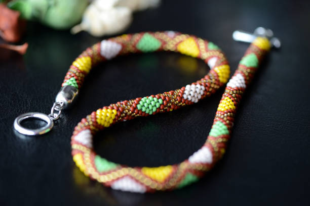 istock Ethnic style beaded necklace on a dark background close up 944600240