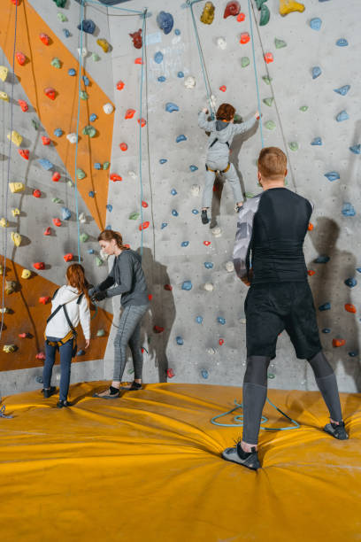 istock family training climbing walls with grips 944613176
