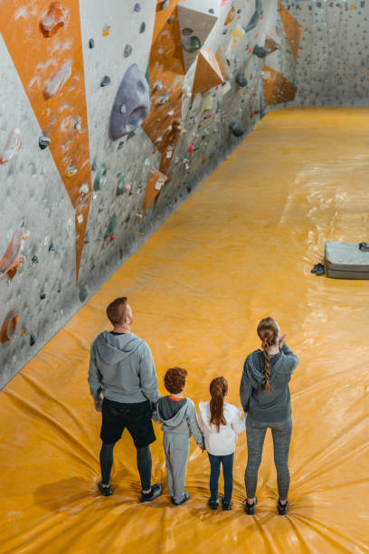 istock family holding hands at gym 944613684