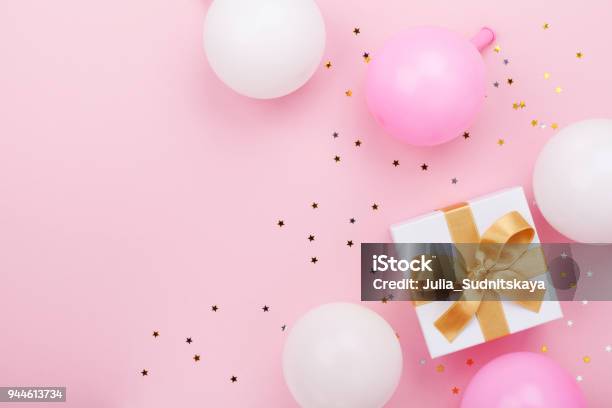 Gift Or Present Box Balloons And Confetti On Pink Table Top View Flat Lay For Birthday Mother Day Or Wedding Stock Photo - Download Image Now