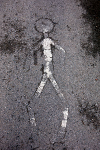 istock Worn Out Stick Man Walk Warning Sign On Path Road 944618722