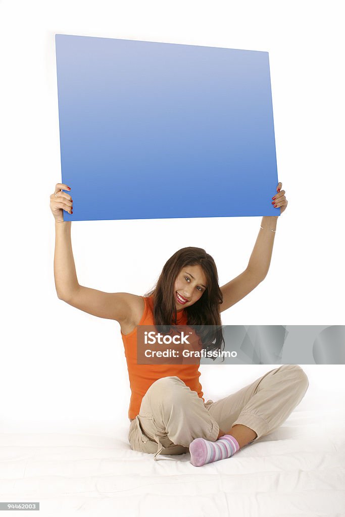 Hermosa Chica sosteniendo en blanco azul de planchar - Foto de stock de 16-17 años libre de derechos