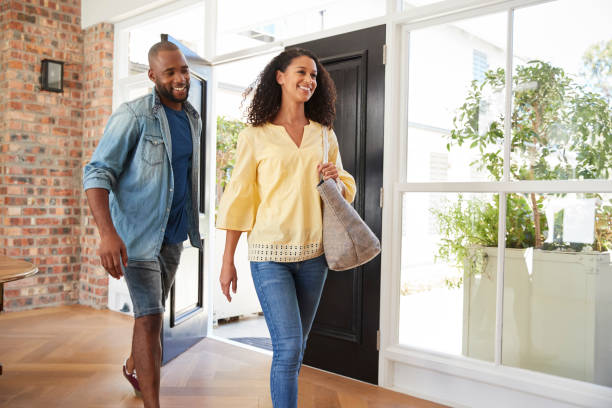 istock Young mixed race couple arriving at home 944620306