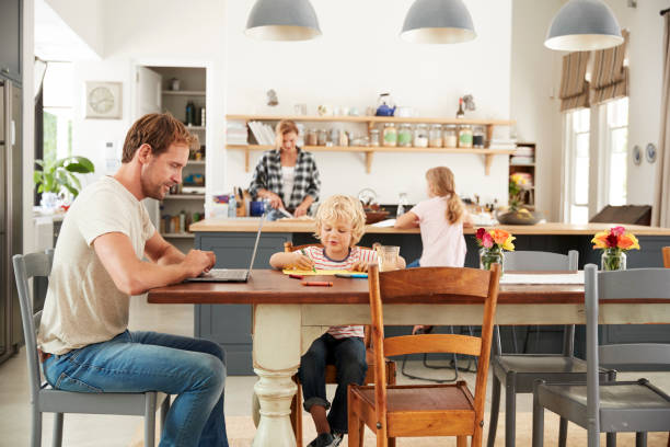 istock Young white family busy working in their kitchen 944620312