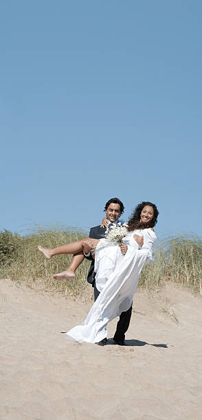 istock Bride and groom in the dunes 94462144