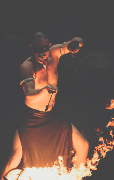 istock Awesome fire show at the waterfall. Brutal muscle man 944622968