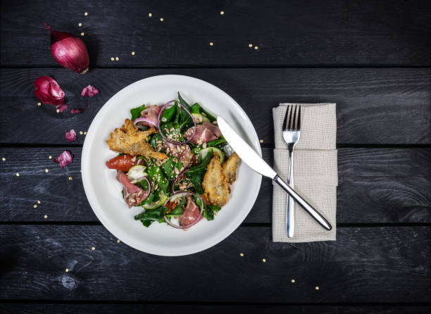 istock Spinach salad with roast beef and mushrooms in breadcrumbs. 944622996