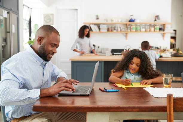 istock Young black family busy working in their kitchen 944626240