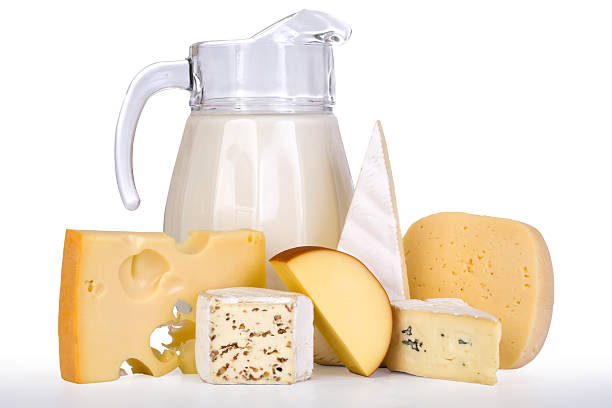 istock Various blocks of cheese with a pitcher of milk 94462719