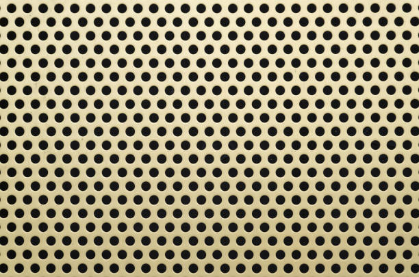istock Close-up of Perforated yellow metal 944629984