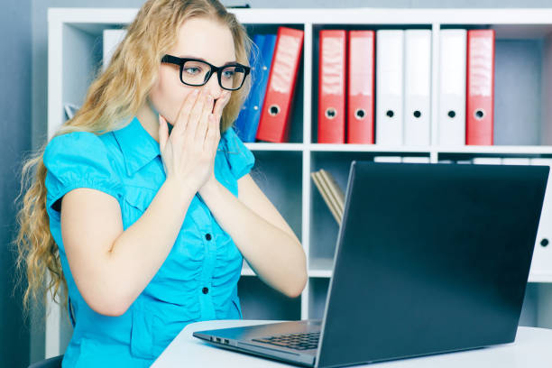 istock Stressed young girl in front of a computer screen. She accidentally deleted files 944633594