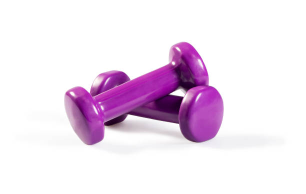 istock Purple dumbbells isolated on white. 944633704