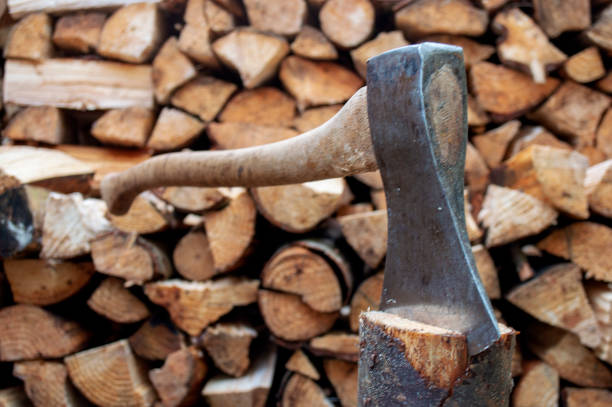 istock Vintage axe in in wood log in spring. 944633798