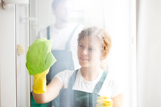 istock Woman cleaning window 944633830