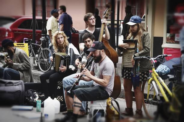 New Orleans, LA—Feb 27, 2018 acoustic band performs act in street located in historic French quarter