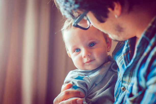 istock Father and baby having fun at home 944634688