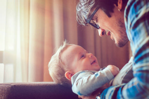 istock Father and baby having fun at home 944634774