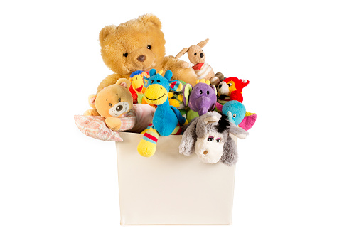 Collection of plush toys in white toys box isolated on white background