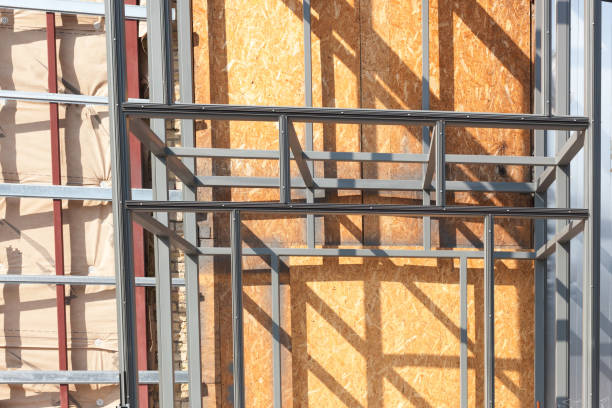 istock Metal frame - construction and exterior insulation of the house. Energy-efficient solution for keeping heat in cold weather 944637544