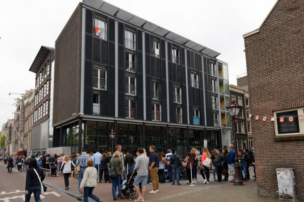Tourists waiting in line to enter the Anne Frank house and Anne Frank Museum at the Prinsengracht in Amsterdam, The Netherlands.