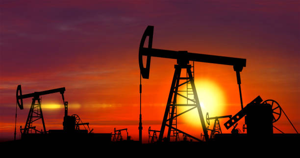 istock Oil pumps - oil extraction on sunset background 944638662