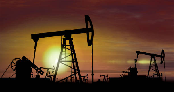 istock Oil pumps - oil extraction on sunset background 944638784