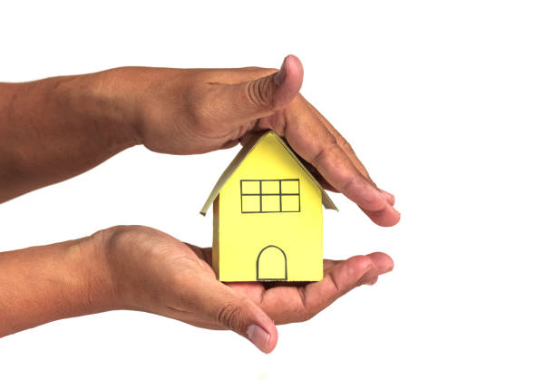 istock house in human hands on a white background 944641756