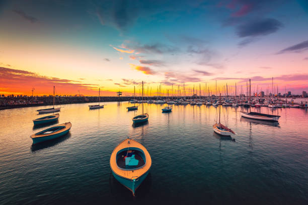 istock Yachts anchored in a row at sunset 944642032