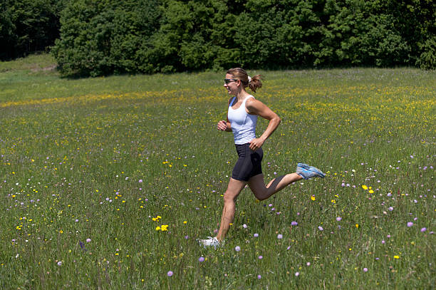 Young man jogging in the woods