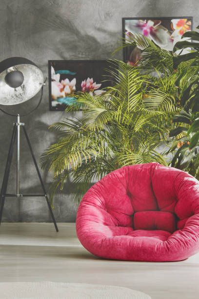 istock Studio with lamp, armchair and plants 944652474