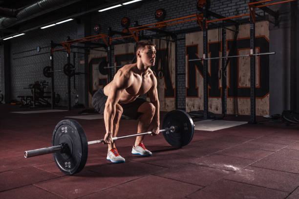 istock Muscular men lifting deadlift 944655170