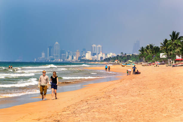 Negombo, Sri Lanka - February 4, 2020: Numerous Sri Lankans enjoy the beach during the full moon holiday season