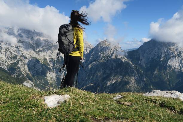 istock Fit young woman enjoying mountain view. 944662112