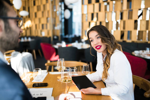 istock Attractive office lady lunching with bearded man 944662610