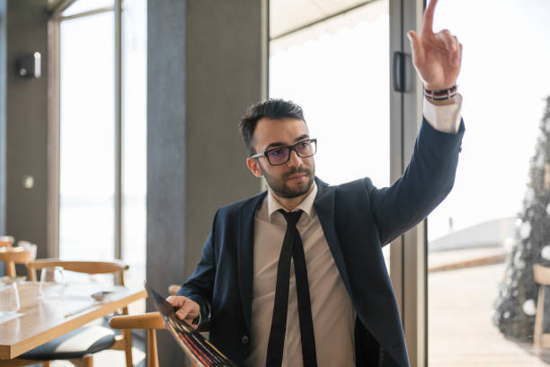 Young businessman at restaurant during lunch break